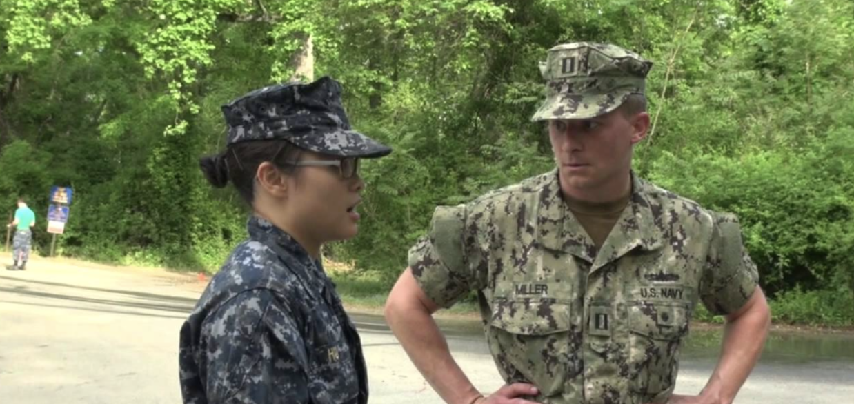 Hu Chao lin, a cadet from Taiwan training at the US Naval Academy in Annapolis, MD, speaking with a faculty instructor